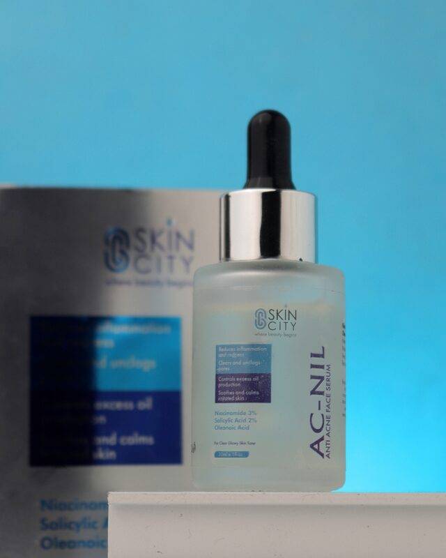 anti-acne serum with niacinamide and salicylic acid to reduce inflammation and oil control